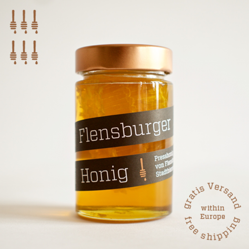 Flensburger Honig mit Wabe, Presshonig von Flensburger Stadtbienen mit Wabenstück aus Naturwabenbau, naturbelassener Stadthonig mit Wabenhonig