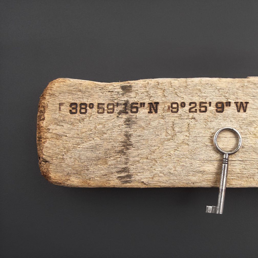 Magnetic Driftwood Board handmade from driftwood with geographic coordinates branded into the wood. To use as a key board or knife strip.