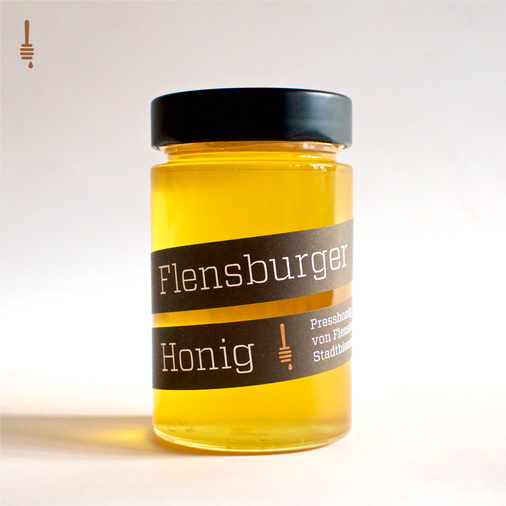 Glass of Flensburger Honig, pressed honey coming from urban beekeeping in Flensburg
